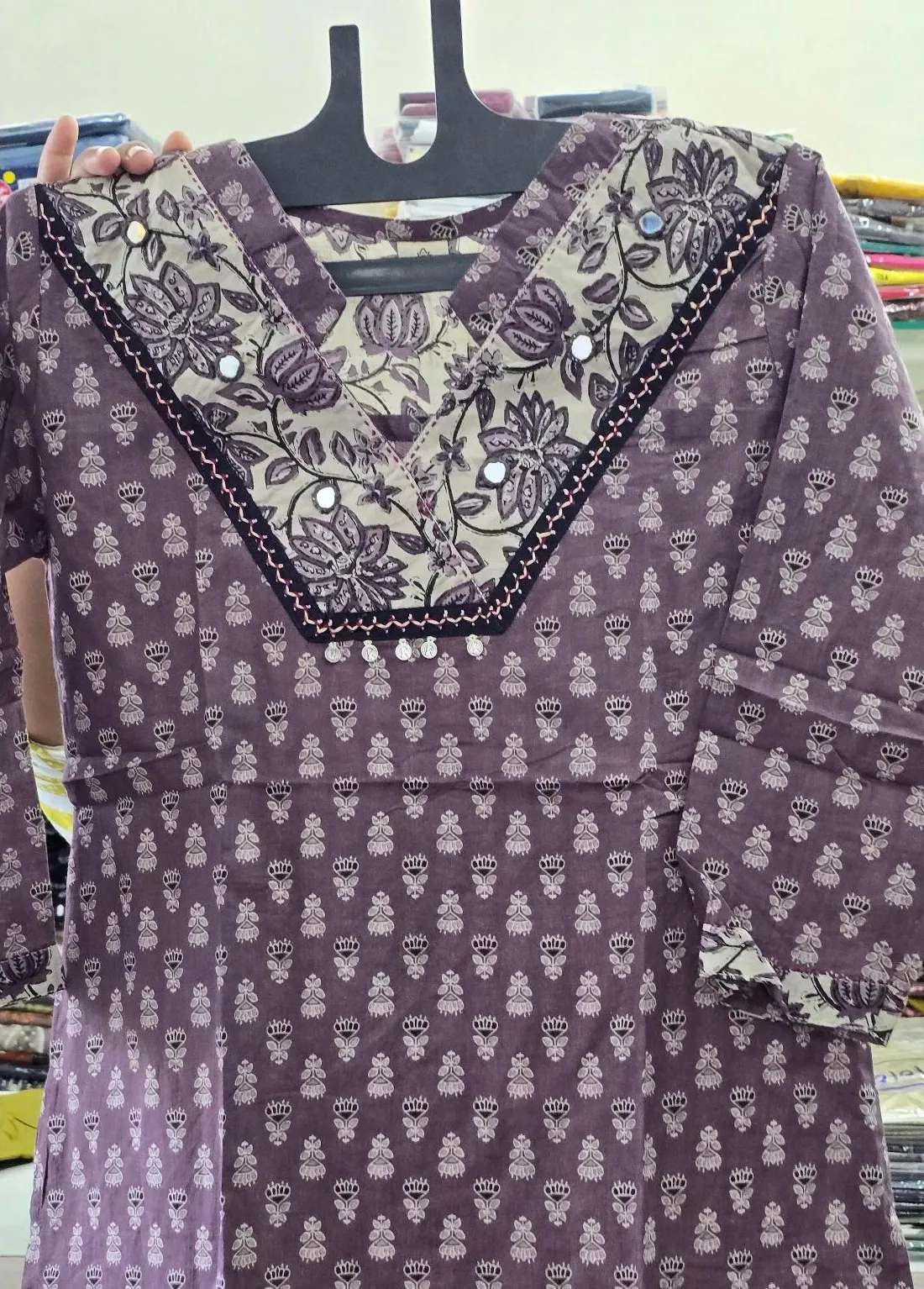 Lavender block-print kurti with embroidered yoke, photographed in store